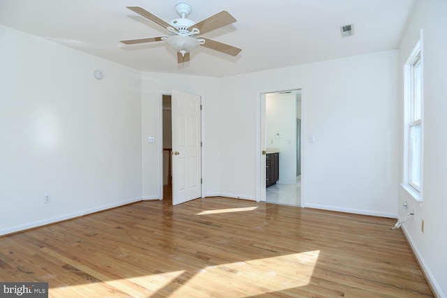 spare room with light hardwood / wood-style flooring and ceiling fan