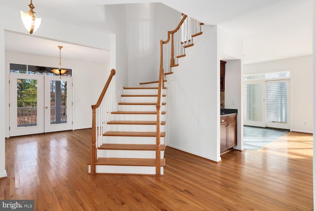 stairs with hardwood / wood-style flooring