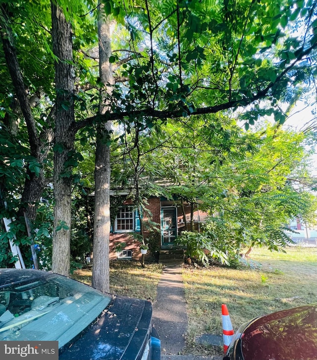 view of property hidden behind natural elements