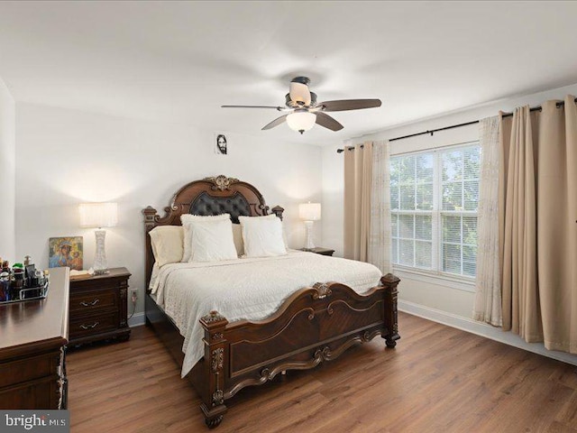 bedroom with hardwood / wood-style flooring and ceiling fan