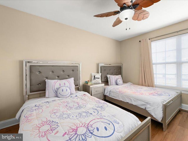 bedroom with light hardwood / wood-style flooring and ceiling fan