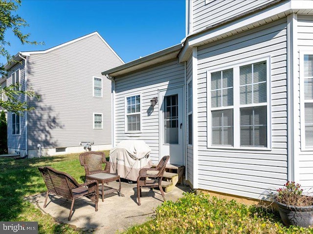 rear view of house featuring a patio