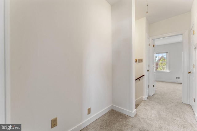 hallway with light carpet