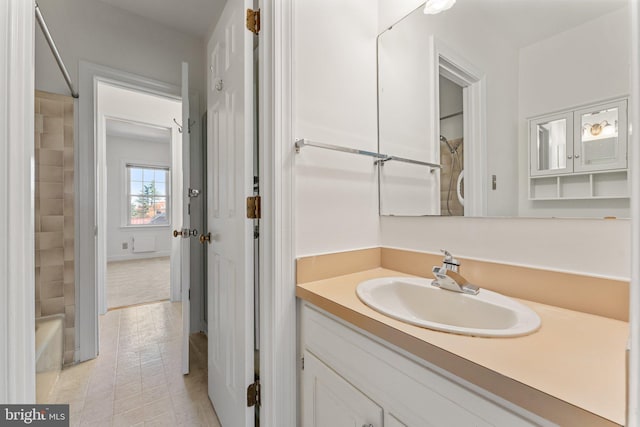 bathroom with vanity, tile patterned floors, and tub / shower combination