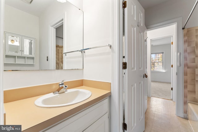 bathroom with vanity and shower / washtub combination