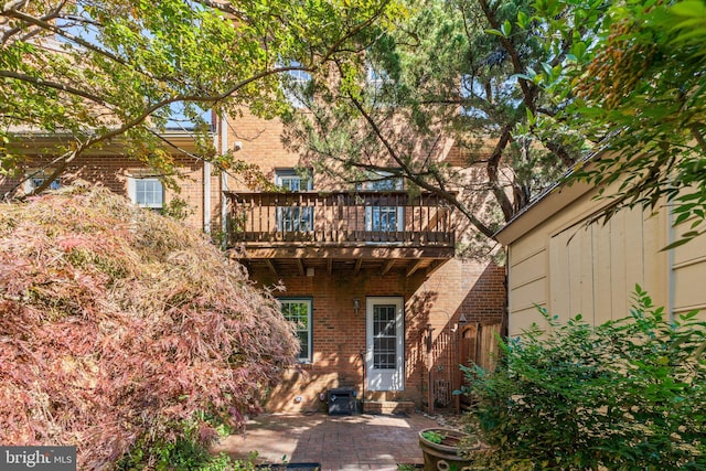 rear view of property featuring a patio area