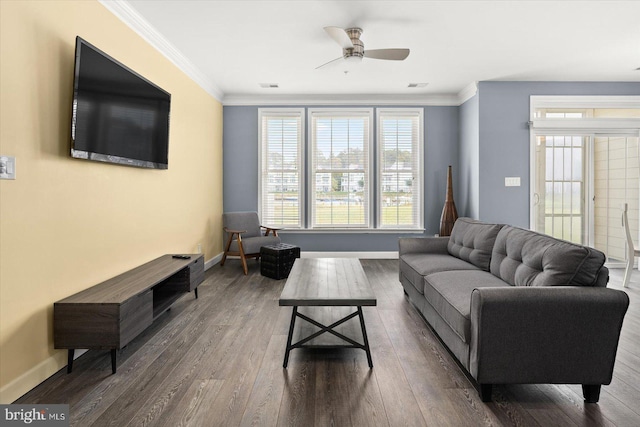 living room with ornamental molding, ceiling fan, and dark hardwood / wood-style flooring