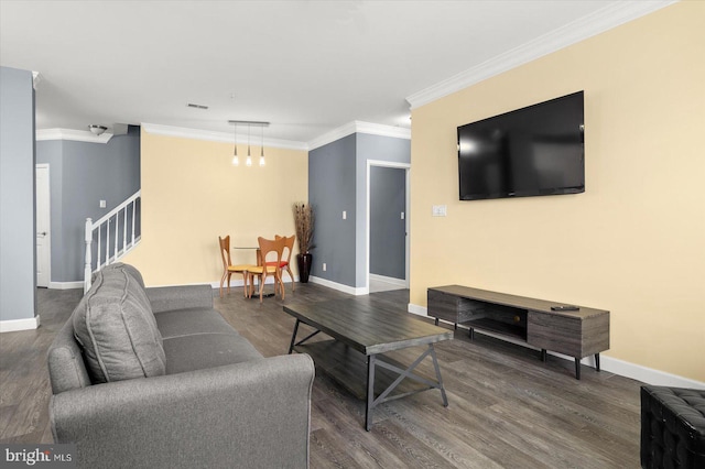 living room with ornamental molding and hardwood / wood-style floors