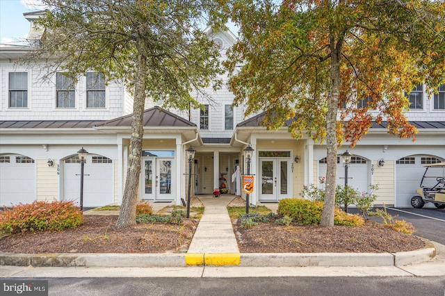 view of front of property featuring french doors and a garage