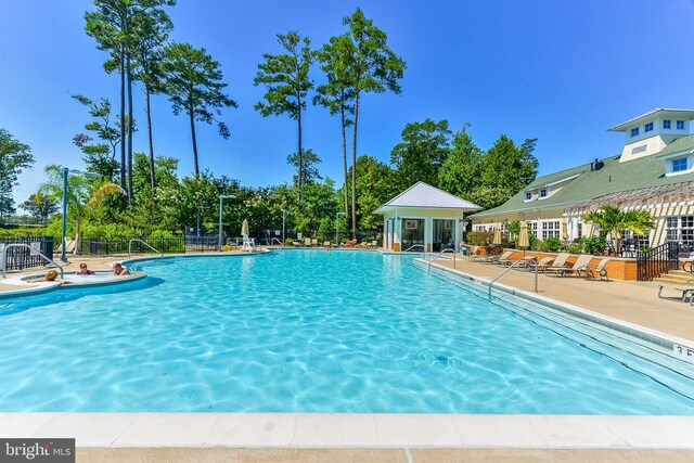 view of swimming pool with a patio area