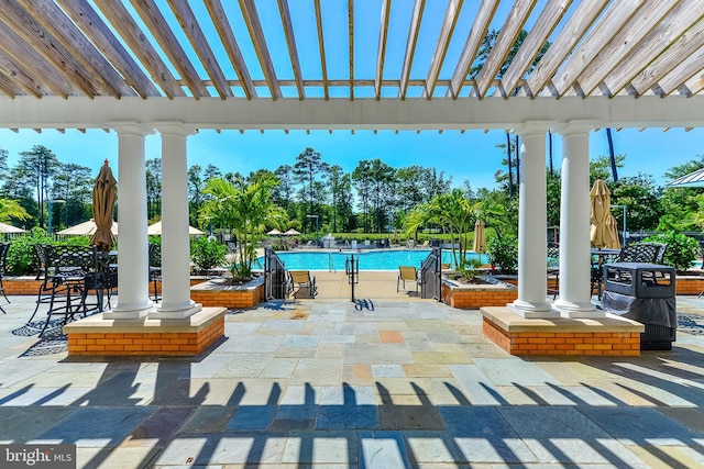 view of patio / terrace featuring a pergola and a community pool