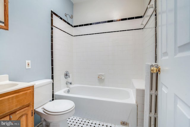 full bathroom featuring vanity, toilet, tile patterned flooring, and tiled shower / bath