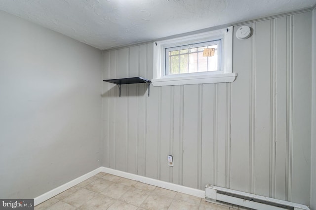 laundry room with baseboard heating