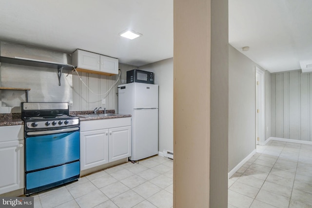 kitchen with white cabinetry, baseboard heating, range, white fridge, and sink