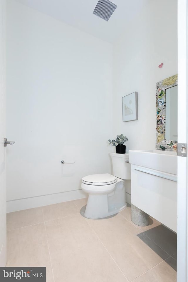 bathroom featuring toilet, tile patterned flooring, visible vents, and vanity