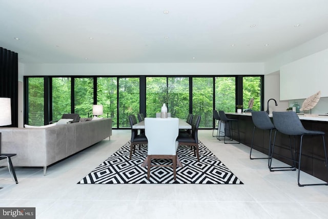 living room featuring light tile patterned floors and plenty of natural light