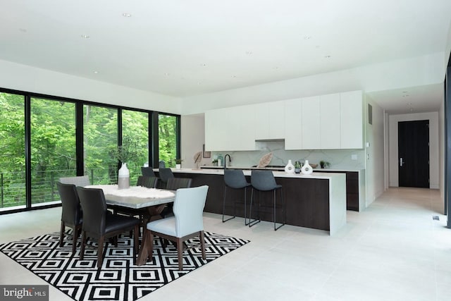 dining area with light tile patterned floors and plenty of natural light