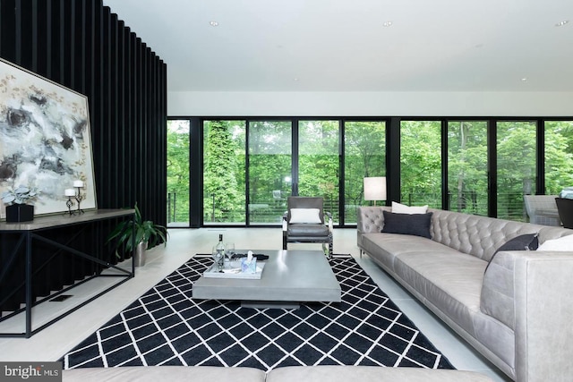 living room with tile patterned flooring and a wealth of natural light