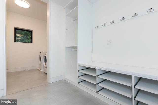 clothes washing area featuring washing machine and dryer