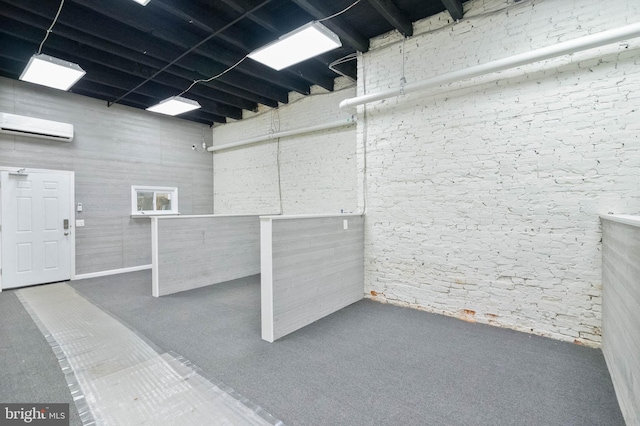 basement featuring a wall unit AC