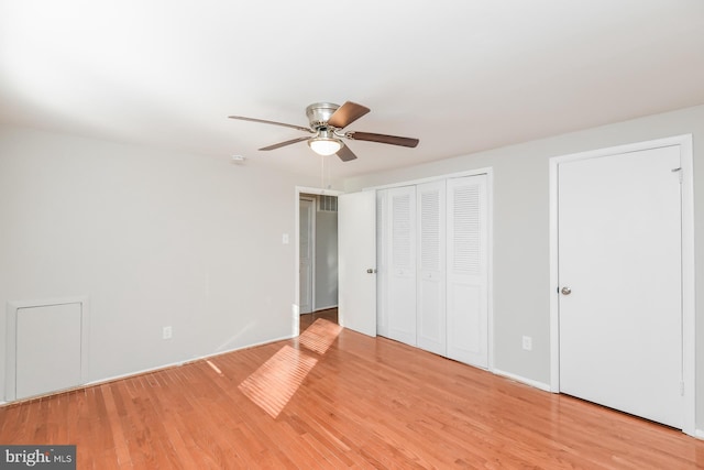 unfurnished bedroom with light hardwood / wood-style floors and ceiling fan