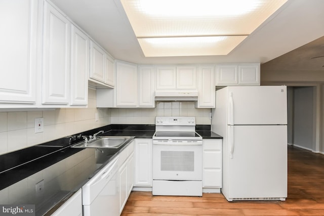 kitchen with light hardwood / wood-style flooring, white cabinetry, sink, and white appliances