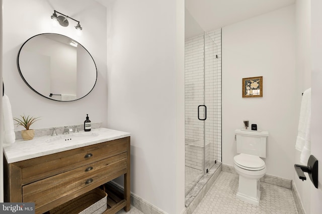 bathroom with toilet, tile patterned flooring, walk in shower, and vanity