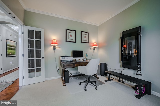 office with wood-type flooring and crown molding