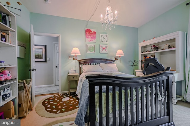 bedroom with light carpet and an inviting chandelier