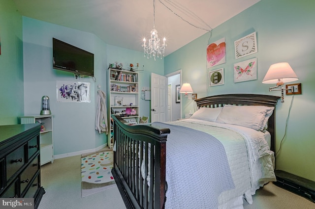 bedroom with a chandelier and carpet