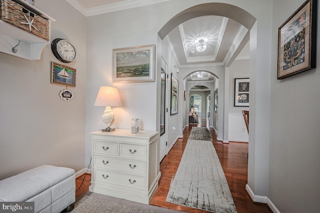 hallway featuring ornamental molding and hardwood / wood-style flooring