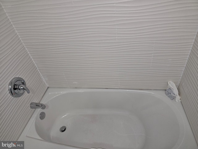 bathroom featuring a tub to relax in