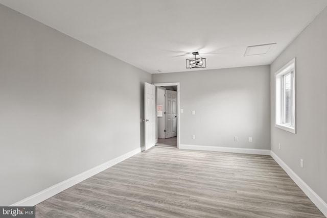 spare room with light hardwood / wood-style floors