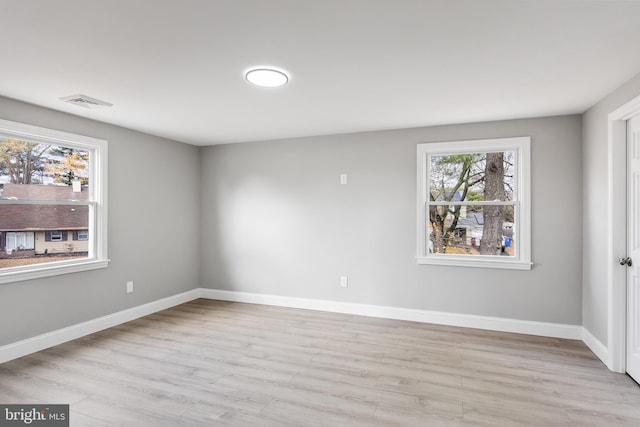 empty room with light hardwood / wood-style floors