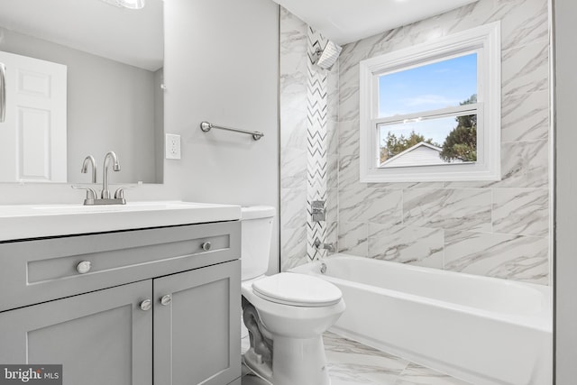 full bathroom featuring toilet, vanity, and tiled shower / bath