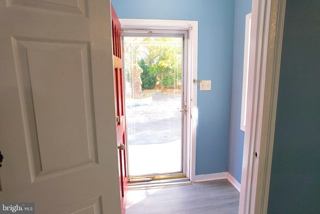 entryway with light hardwood / wood-style floors