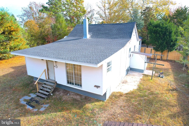 2810 Panther Rd, Vineland, NJ 08361 - exterior space featuring fence, a shingled roof, and a chimney