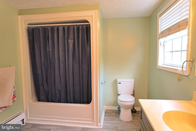 bathroom with toilet, hardwood / wood-style floors, and a wealth of natural light