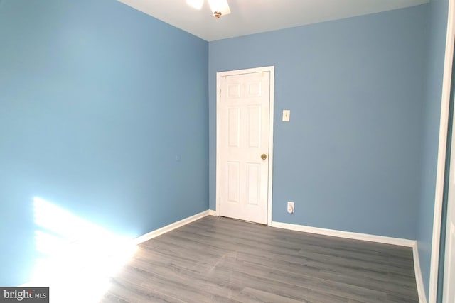 unfurnished room featuring hardwood / wood-style flooring