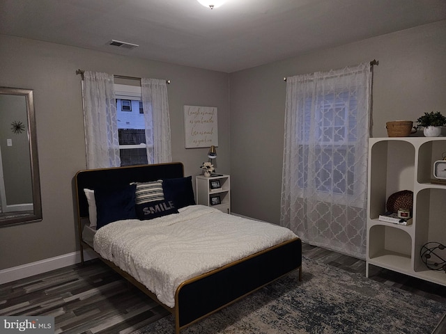 bedroom featuring dark wood-type flooring