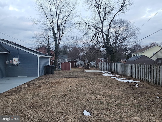 view of yard with a patio area and a storage unit