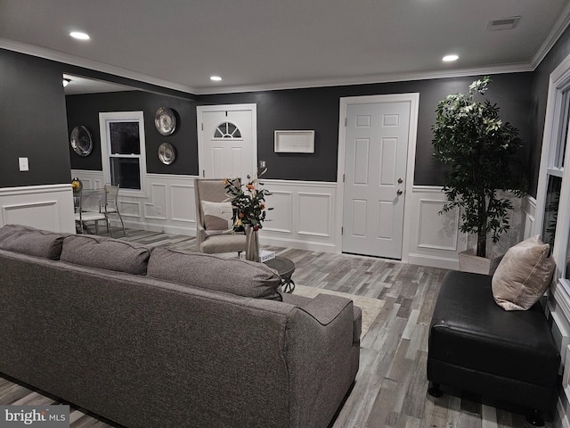 living room featuring ornamental molding and hardwood / wood-style flooring