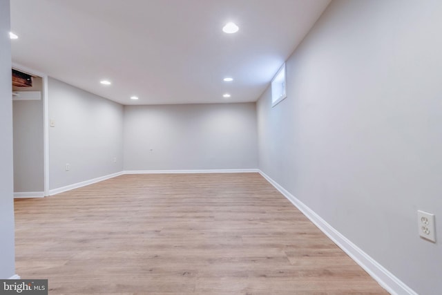 basement featuring light wood-type flooring