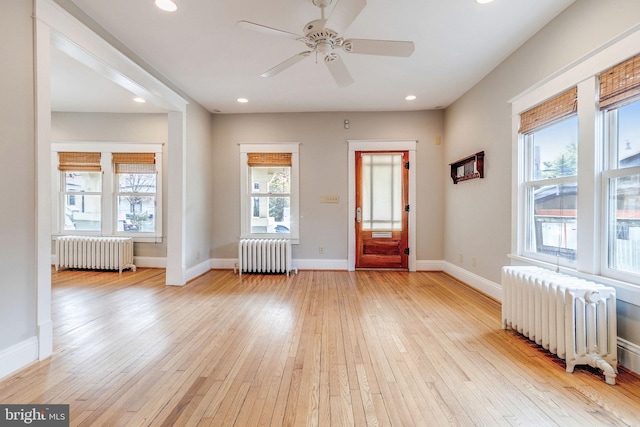 entryway with radiator and a healthy amount of sunlight