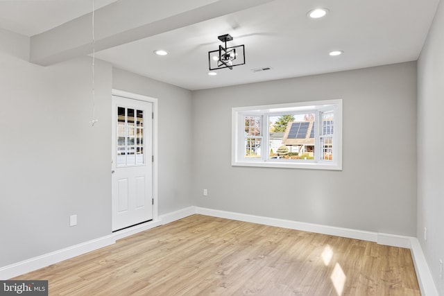 unfurnished room featuring light wood-type flooring