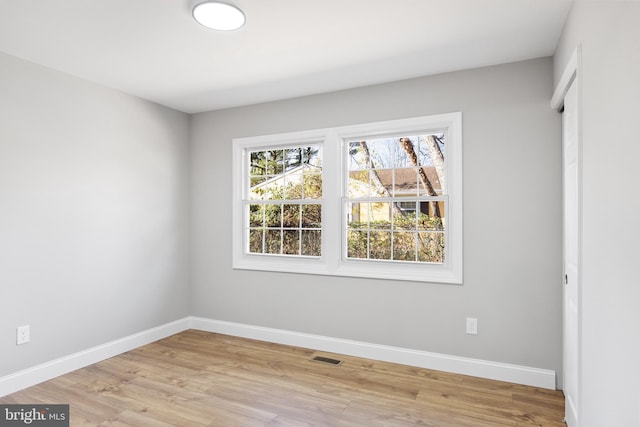 unfurnished room featuring light hardwood / wood-style flooring