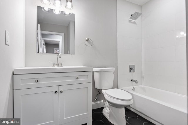 full bathroom with tile patterned flooring, vanity, toilet, and tiled shower / bath