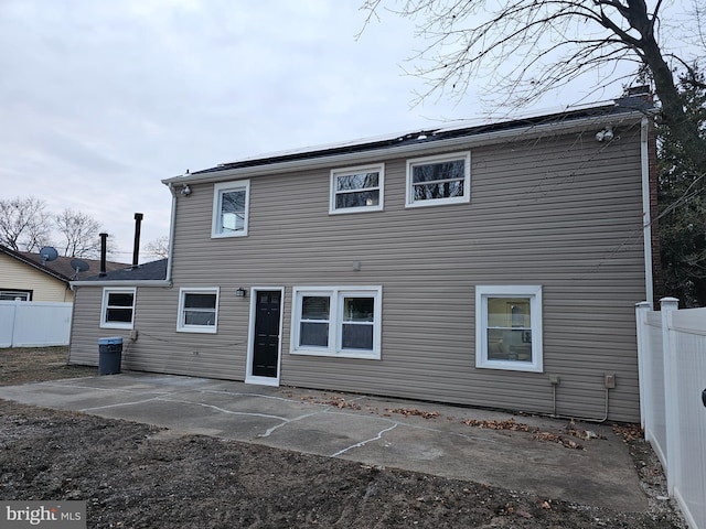 rear view of property featuring a patio