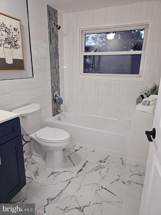 54 Shelbourne Ln, Willingboro, NJ 08046 - full bathroom with tile walls, toilet, vanity, marble finish flooring, and shower / bathtub combination