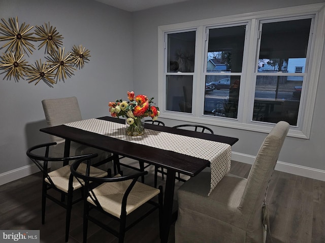 dining area featuring dark hardwood / wood-style flooring